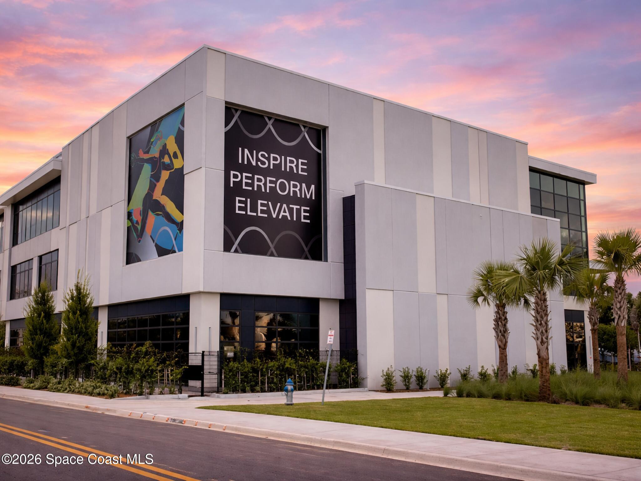 11940 Kirby Smith Road Orlando, FL 32832 - Photo 29 of 39 a view of a building with a sign board