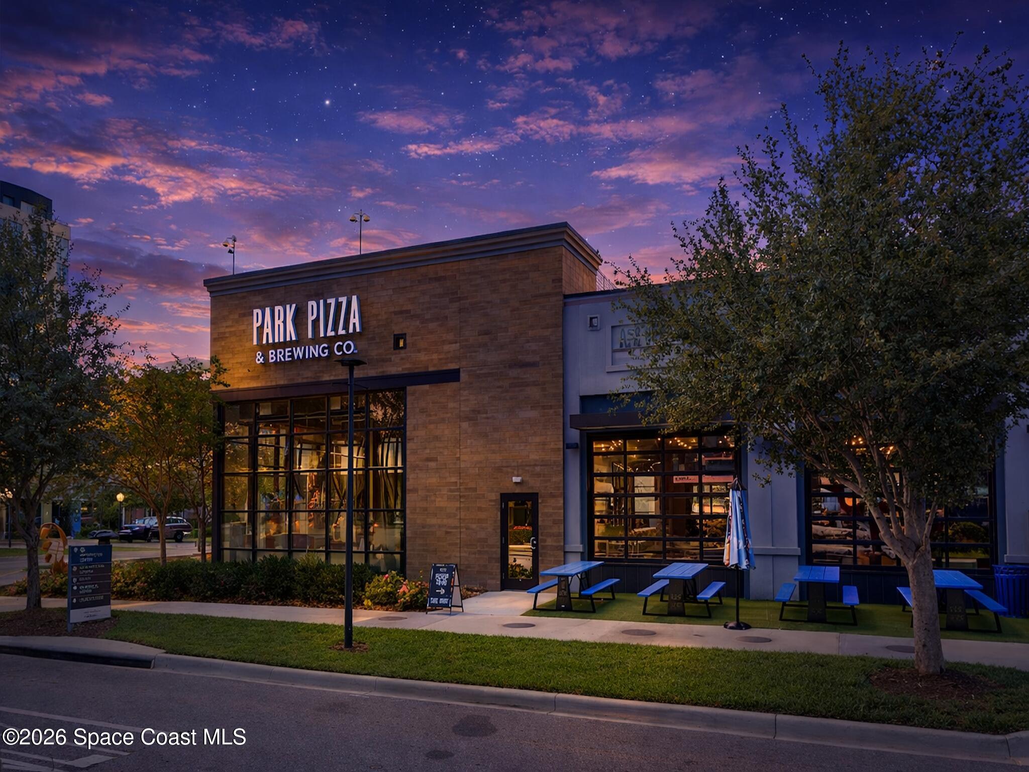 11940 Kirby Smith Road Orlando, FL 32832 - Photo 34 of 39 a front view of a building with garden