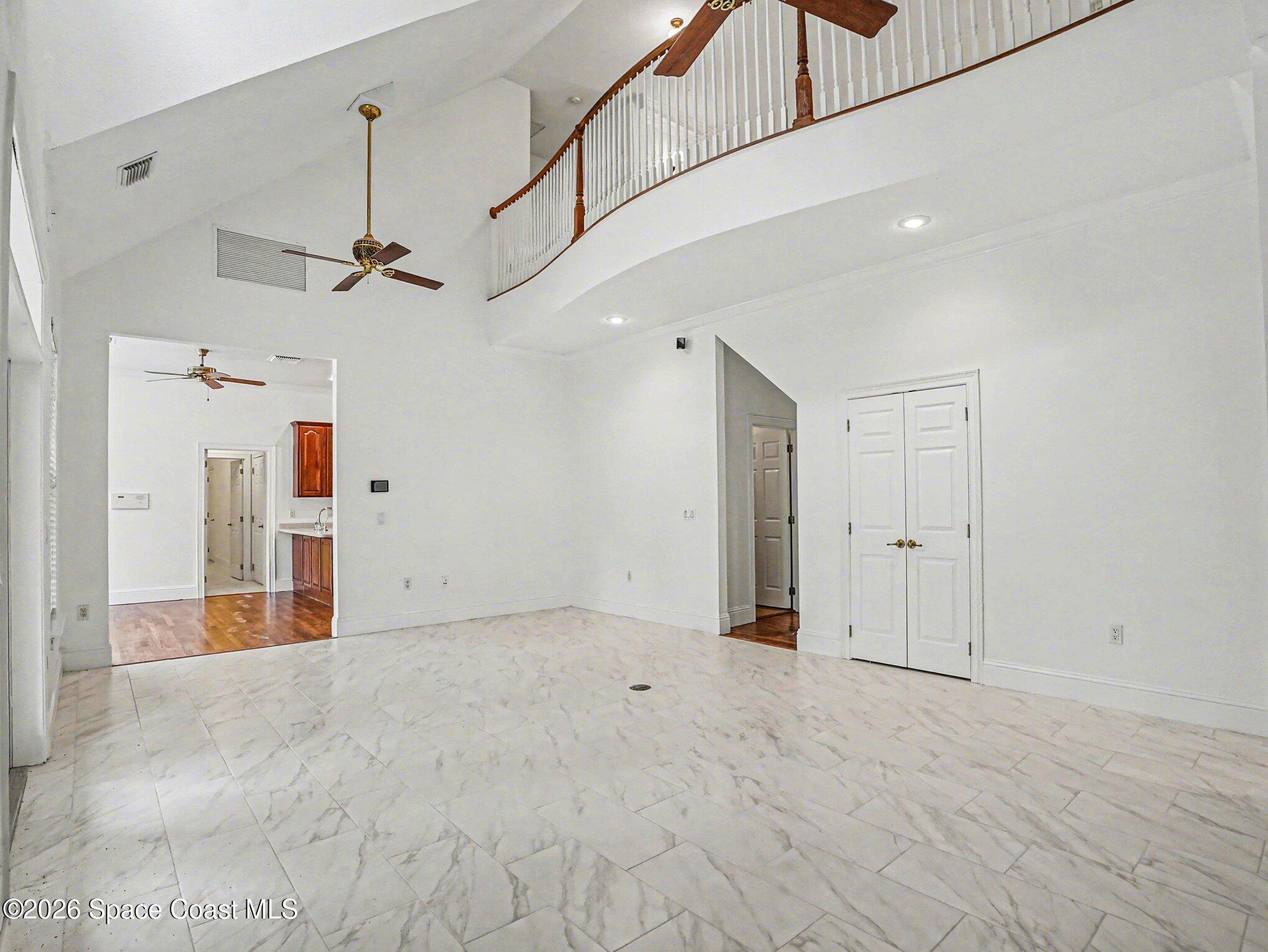 11940 Kirby Smith Road Orlando, FL 32832 - Photo 8 of 39 a view of a livingroom with a ceiling fan