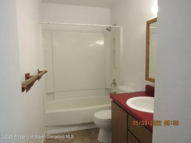 a bathroom with a sink a toilet and a bathtub
