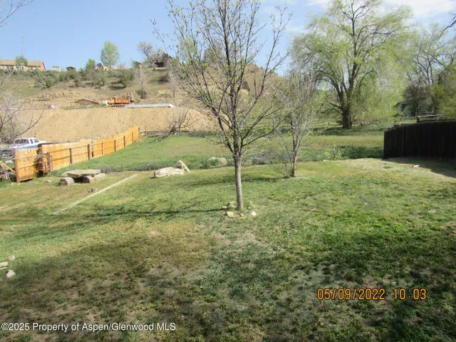 a view of a yard with an outdoor space