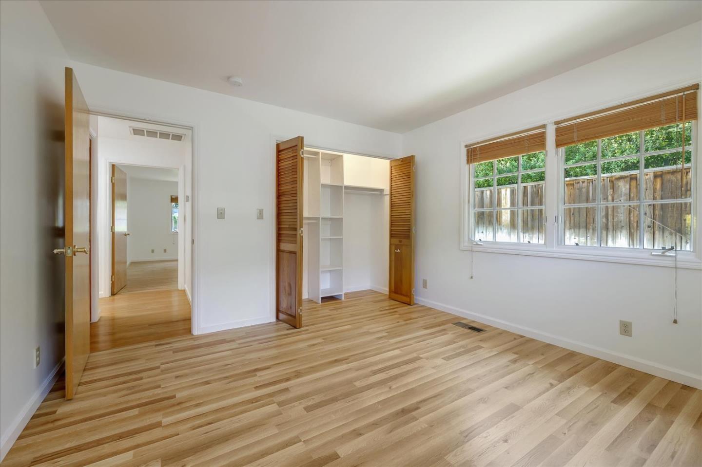 Toyon Road Atherton, CA 94027 - Photo 11 of 21 a view of an empty room with wooden floor and a window