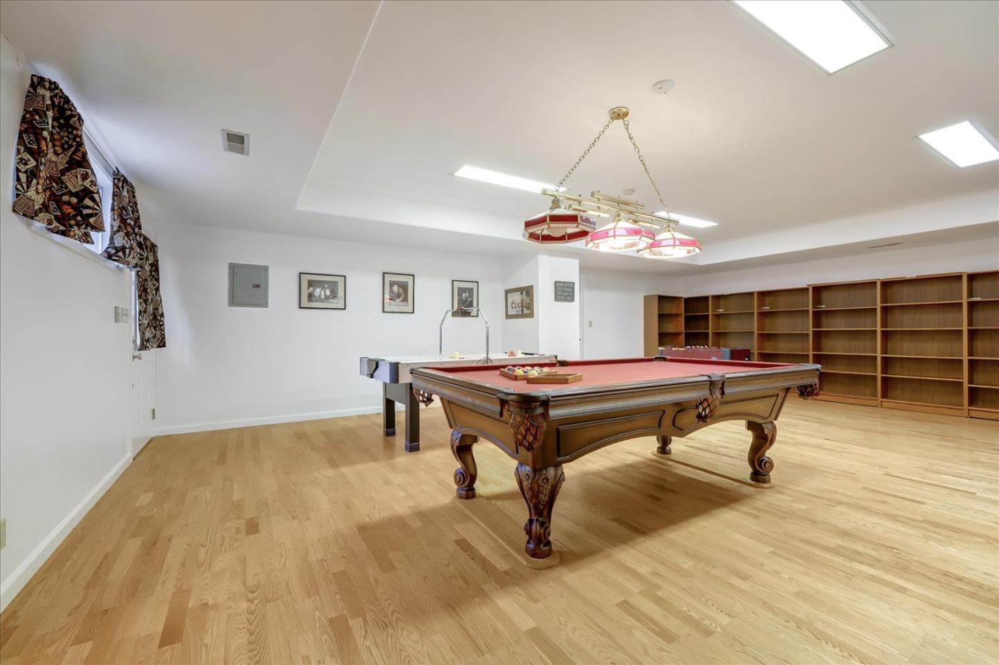 Toyon Road Atherton, CA 94027 - Photo 19 of 21 a room with wooden floor pool table and windows