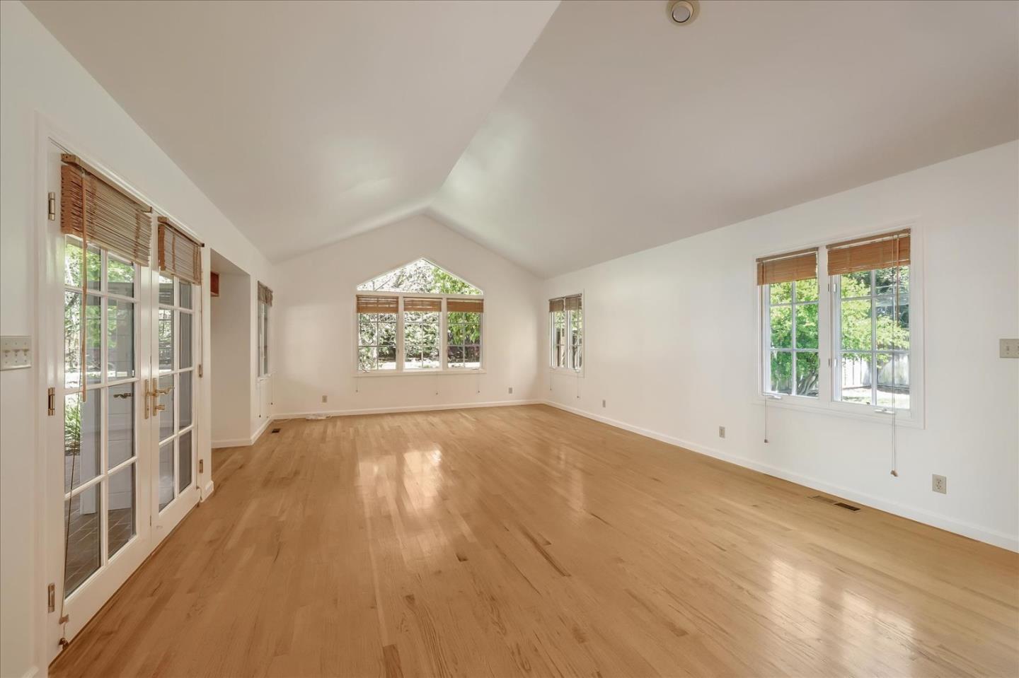 Toyon Road Atherton, CA 94027 - Photo 5 of 21 an empty room with wooden floor and windows