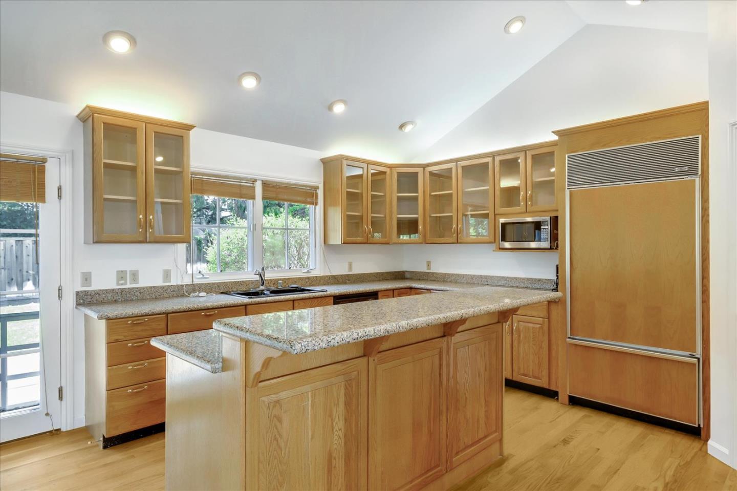 Toyon Road Atherton, CA 94027 - Photo 7 of 21 a kitchen with stainless steel appliances granite countertop a sink and a refrigerator