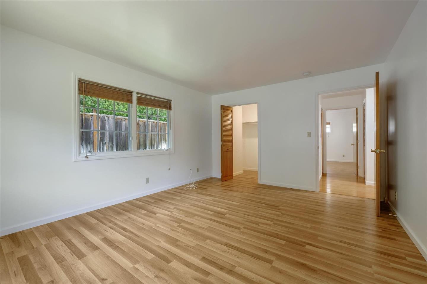 Toyon Road Atherton, CA 94027 - Photo 9 of 21 a view of an empty room with wooden floor and a window