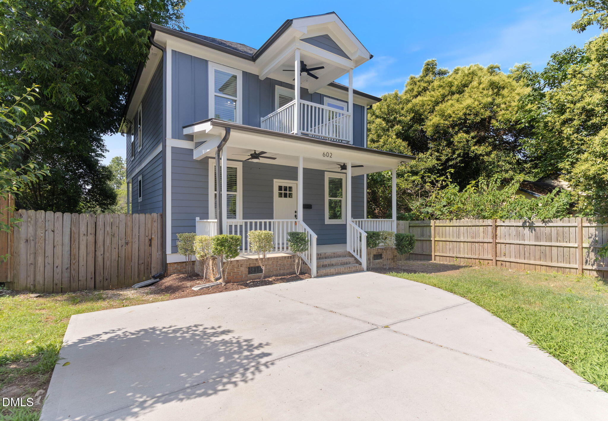 602 Hay Lane Raleigh, NC 27601 - Photo 2 of 43 a front view of a house with a garden and patio