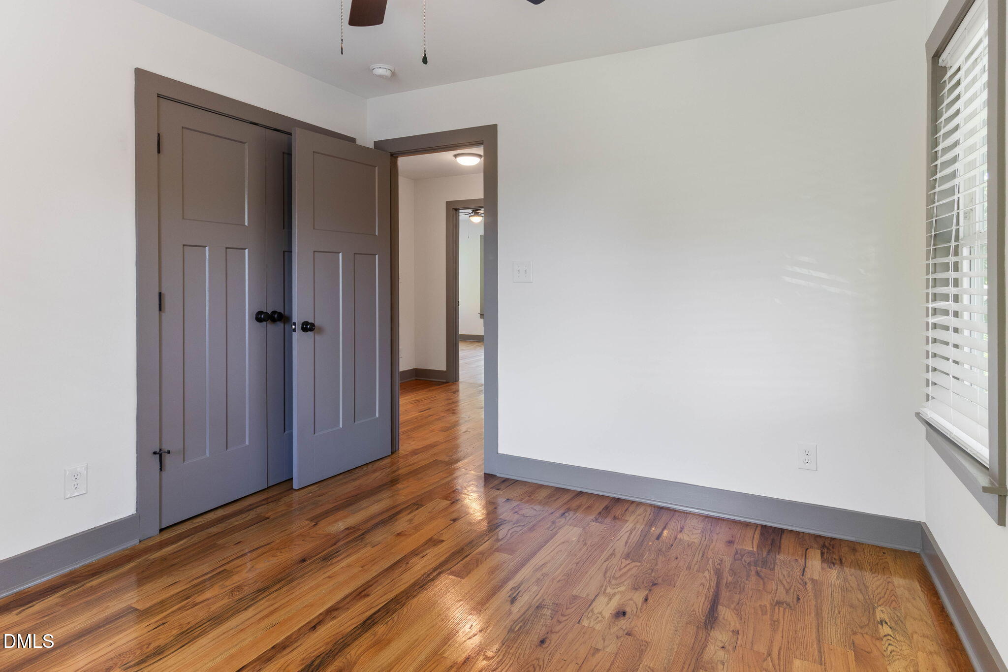 602 Hay Lane Raleigh, NC 27601 - Photo 21 of 43 a view of hallway with a large window and wooden floor