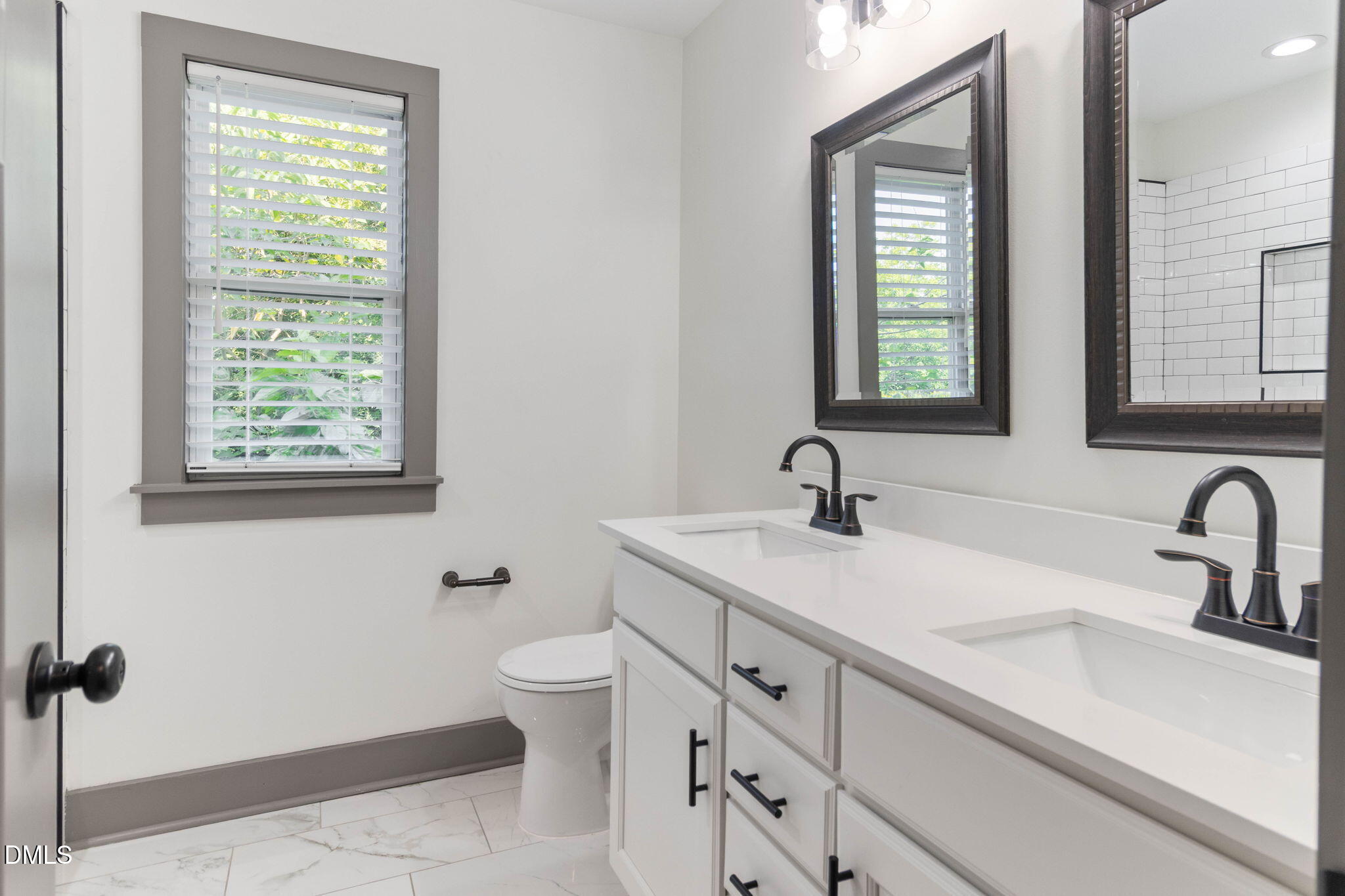 602 Hay Lane Raleigh, NC 27601 - Photo 24 of 43 a bathroom with a sink and a toilet