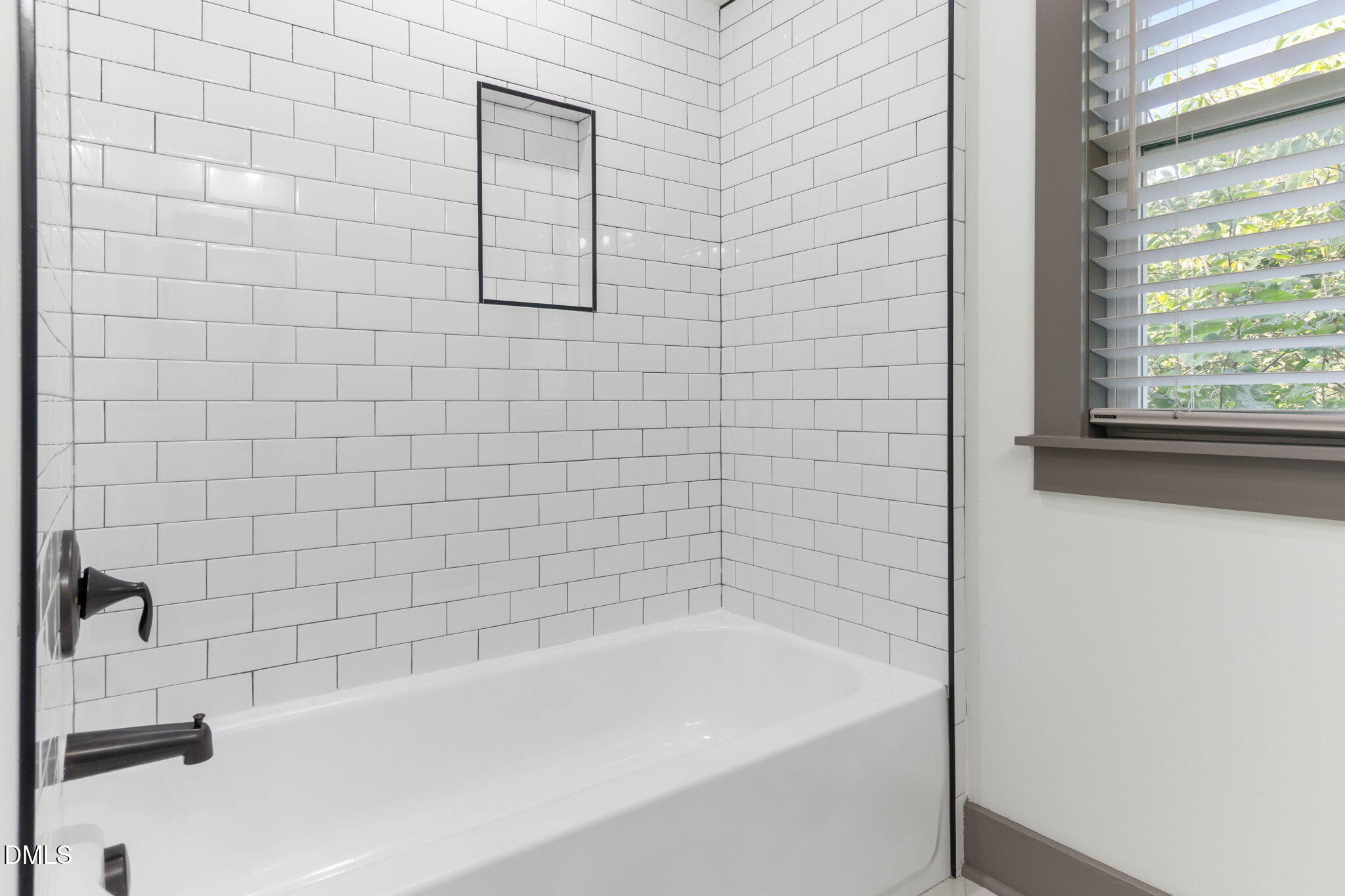 602 Hay Lane Raleigh, NC 27601 - Photo 25 of 43 a bathroom with a bathtub