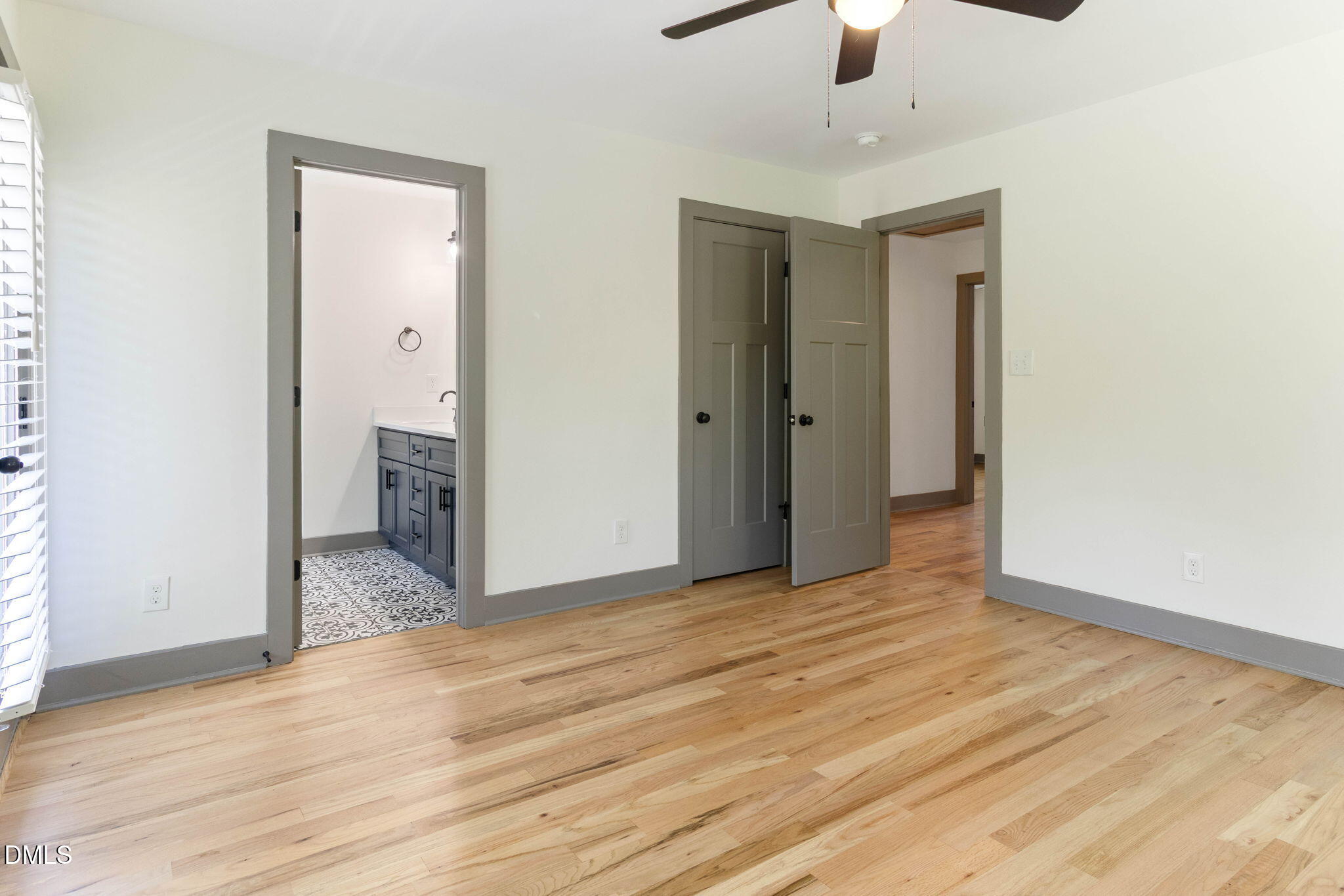 602 Hay Lane Raleigh, NC 27601 - Photo 28 of 43 an empty room with ceiling fan and wooden floor