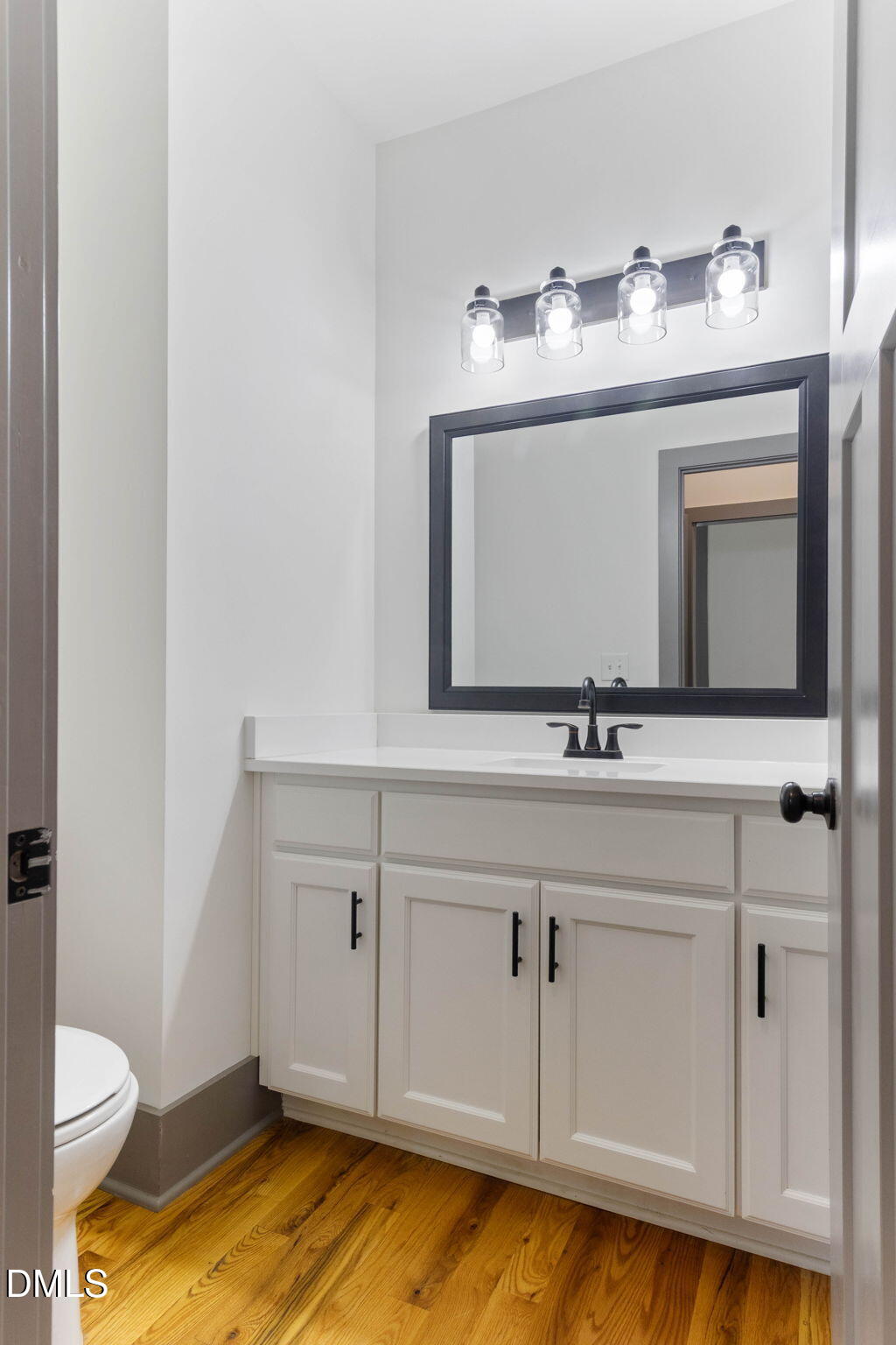 602 Hay Lane Raleigh, NC 27601 - Photo 32 of 43 a bathroom with a toilet sink and mirror