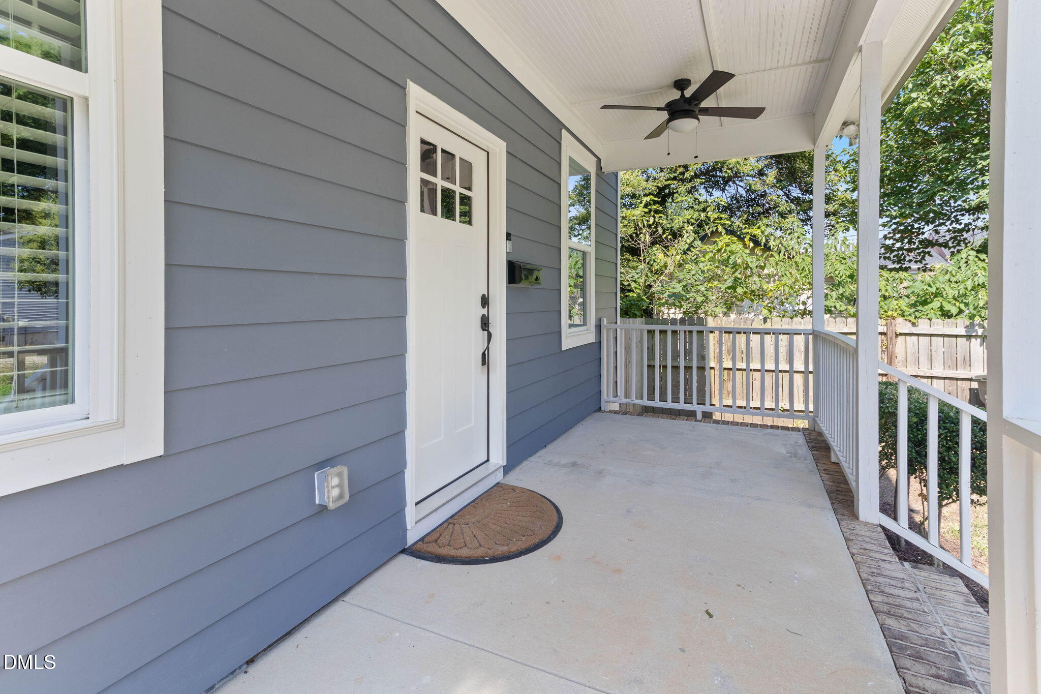 602 Hay Lane Raleigh, NC 27601 - Photo 36 of 43 a view of a porch with furniture and floor to ceiling window
