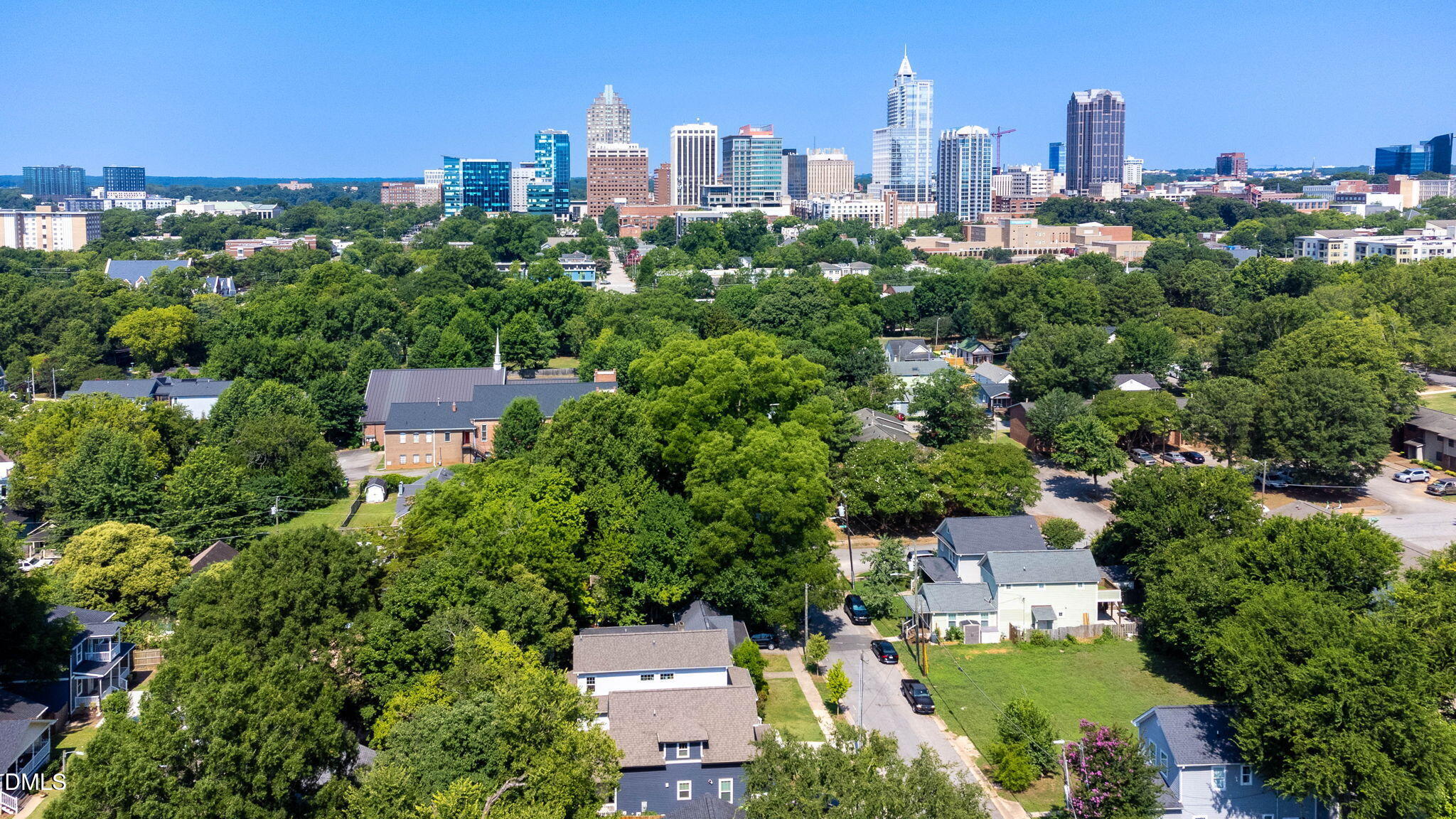 602 Hay Lane Raleigh, NC 27601 - Photo 39 of 43 an aerial view of a city with lots of residential buildings lake and ocean view