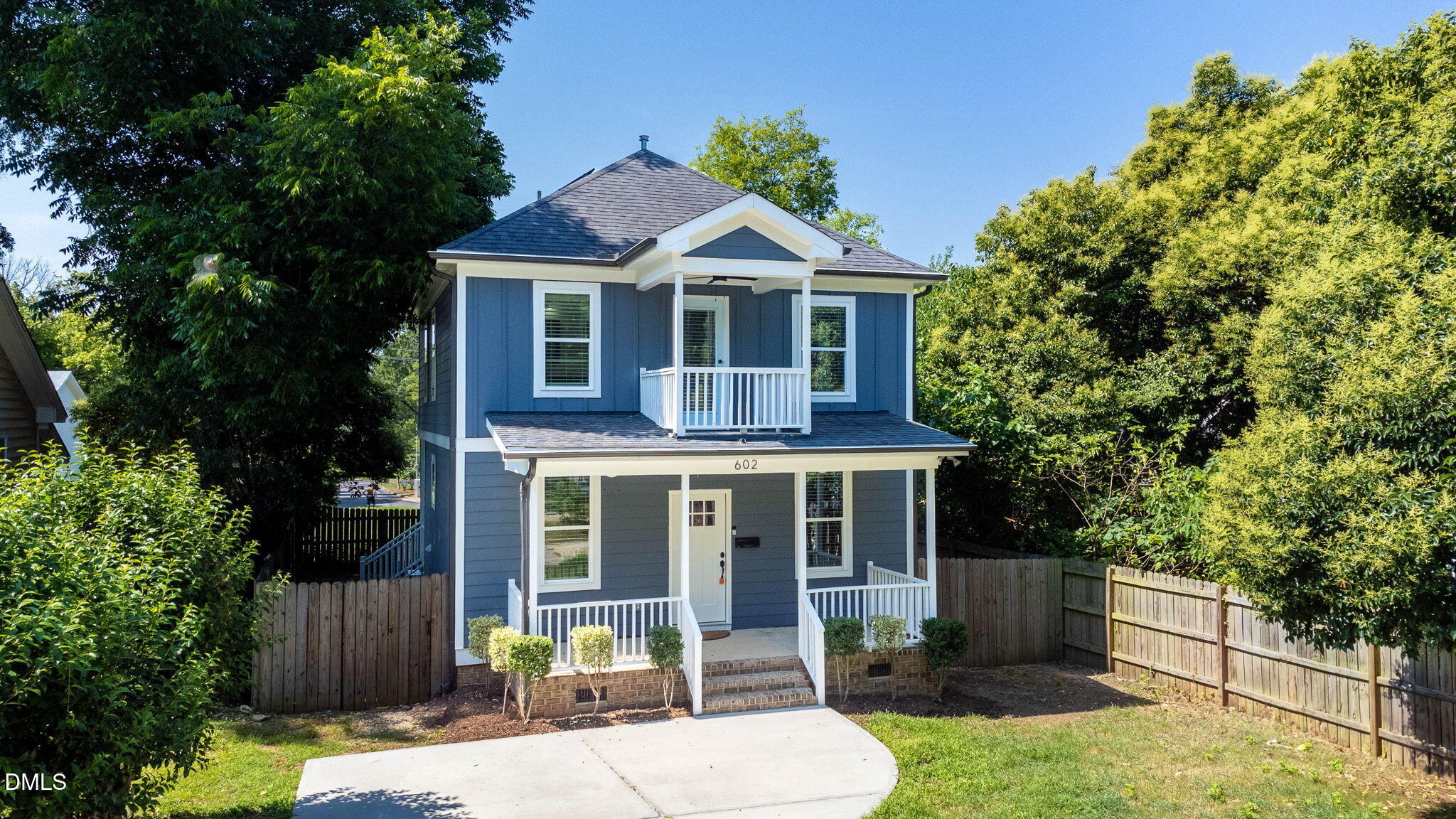 602 Hay Lane Raleigh, NC 27601 - Photo 4 of 43 a front view of a house with a yard