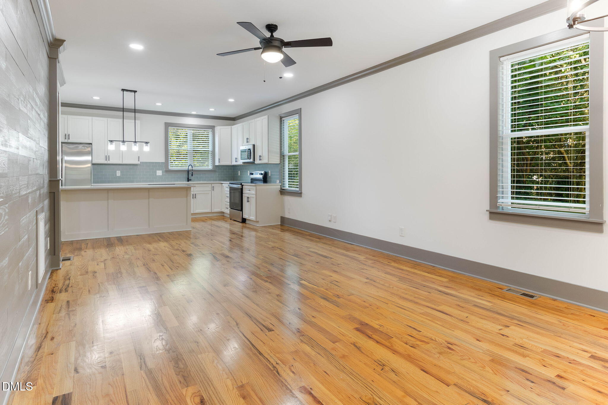 602 Hay Lane Raleigh, NC 27601 - Photo 7 of 43 a view of kitchen with cabinets appliances and wooden floor