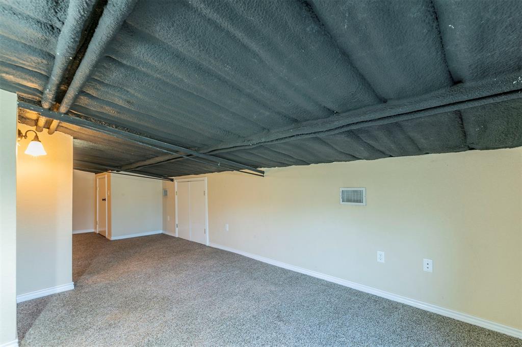 32471 Highway 108 Mingus, TX 76463 - Photo 23 of 40 Carpeted empty room with visible vents and baseboards