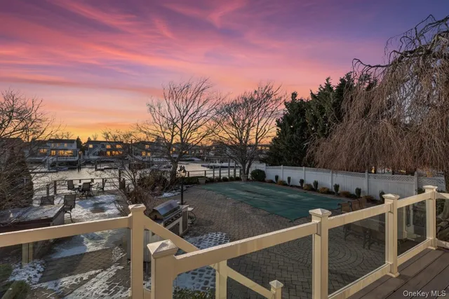 a view of a swimming pool and trees in the background