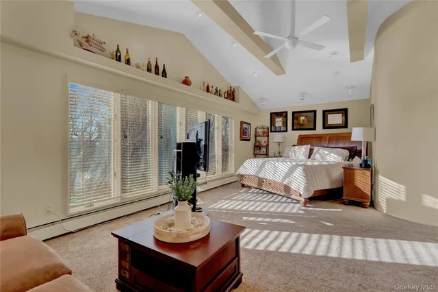 a bedroom with furniture and a table