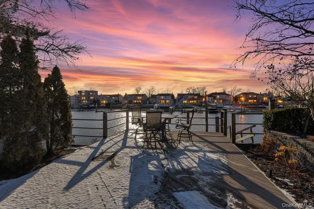 a view of a terrace with wooden floor and city view