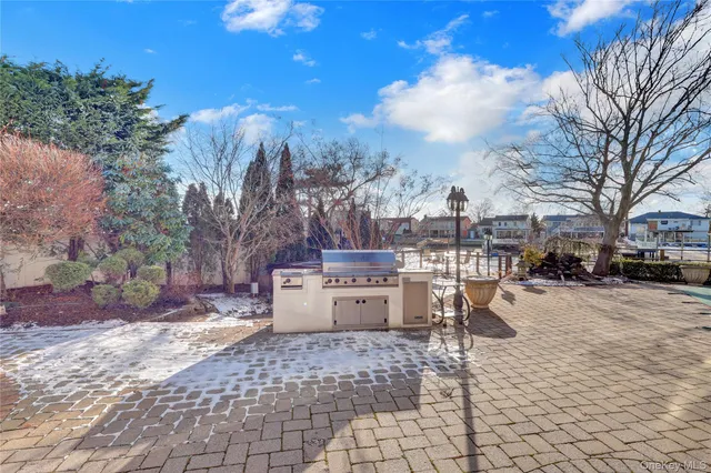 a view of a yard with furniture and trees