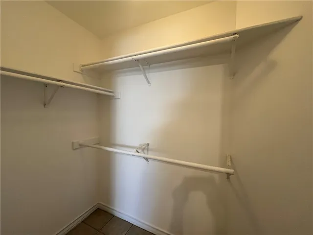 a view of an empty walk in closet