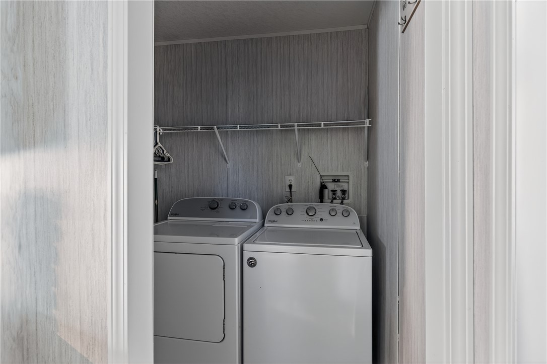 862 North Old Mill Road Easley, SC 29640 - Photo 7 of 24 This dedicated utility space offers convenient laundry facilities with shelving for organization.