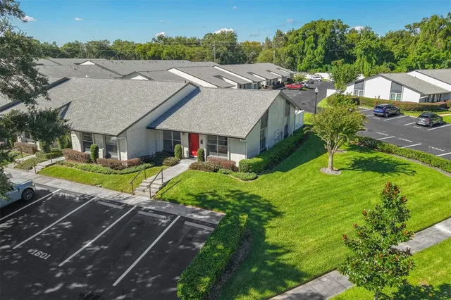 a aerial view of a house with a yard