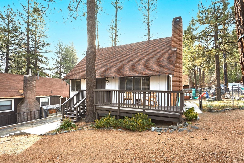 1749 Linnet Road Wrightwood, CA 92397 - Photo 1 of 1 a front view of a house with a yard