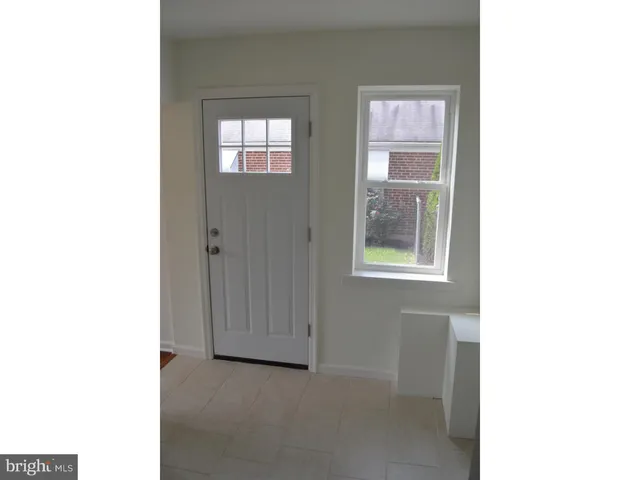 a view of an empty room with windows