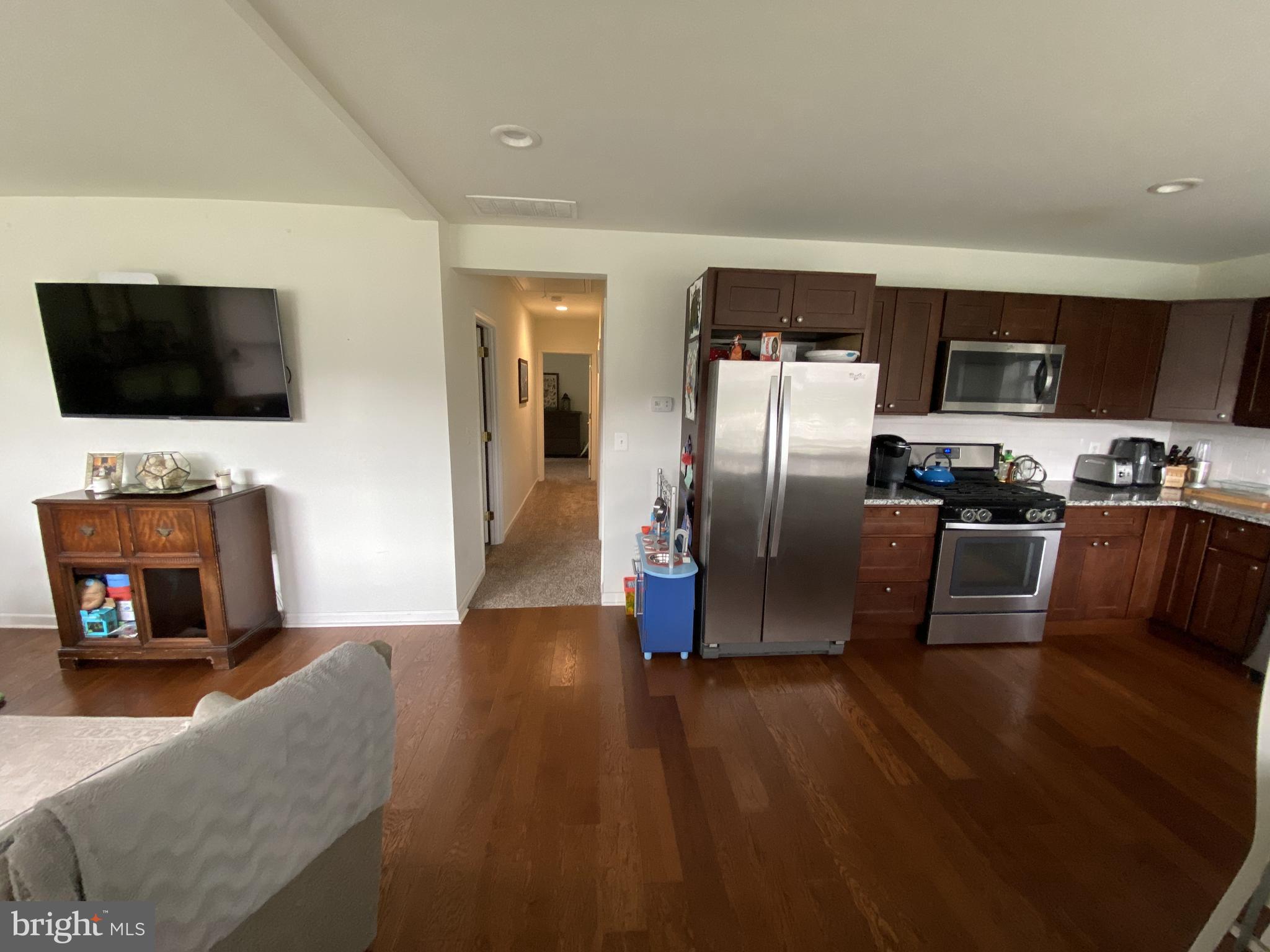 13 Brookside Road Glenside, PA 19038 - Photo 3 of 22 a living room with stainless steel appliances furniture and a flat screen tv
