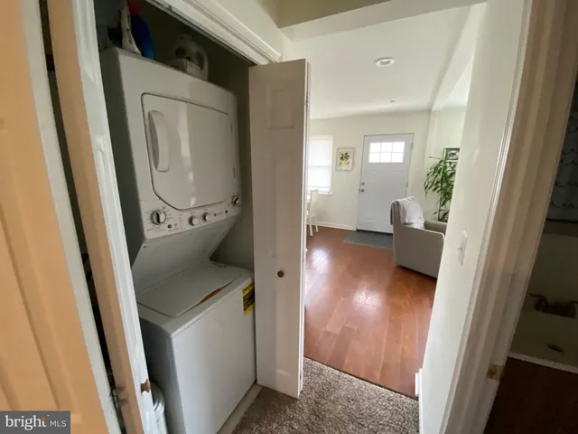 hallway with wooden floor and furniture