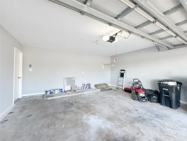 a view of empty room with ceiling fan