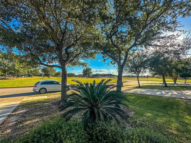 a view of a swimming pool with an outdoor space and seating area