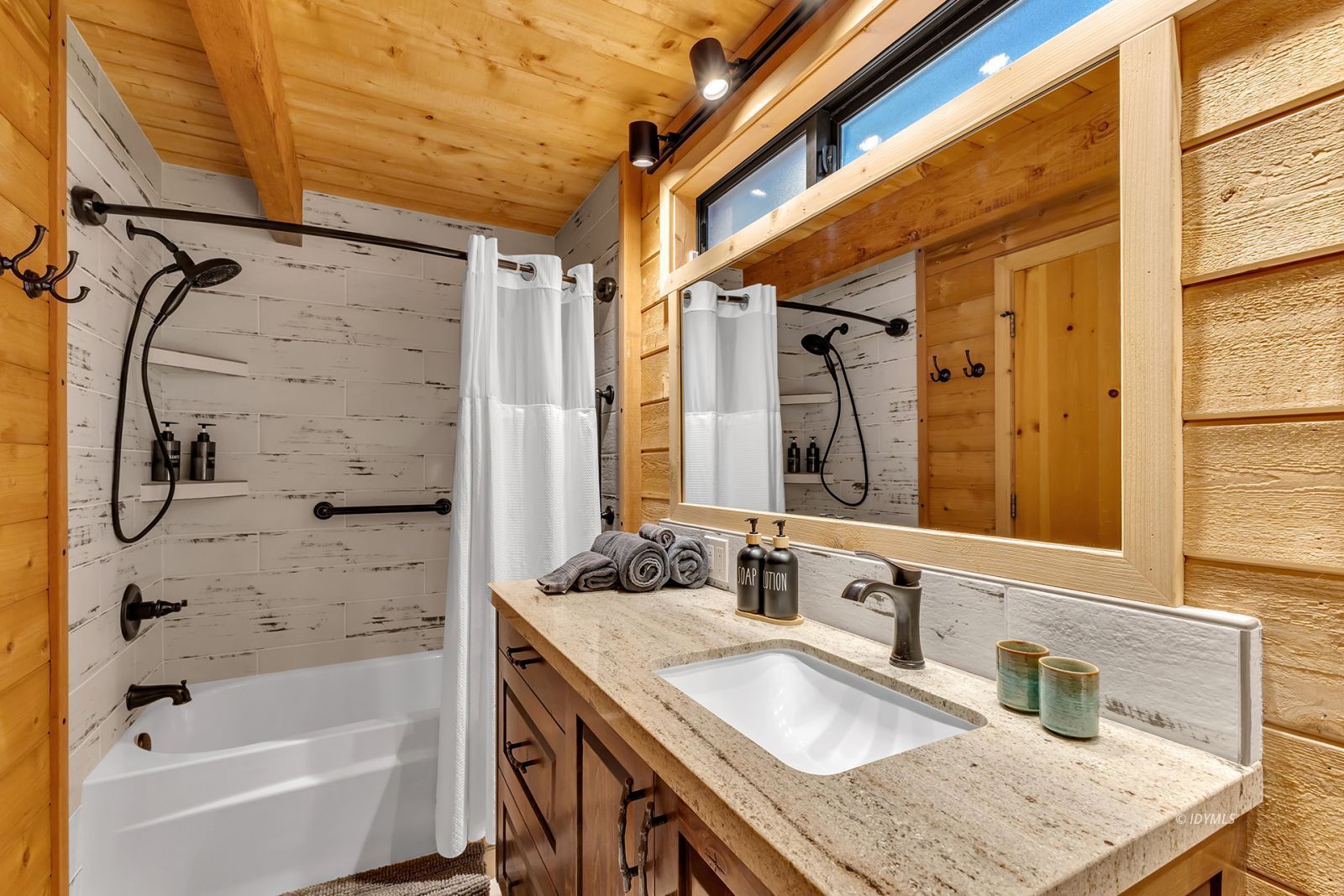 24924 Fern Valley Road Idyllwild, CA 92549 - Photo 65 of 72 a bathroom with a granite countertop sink a bathtub and shower
