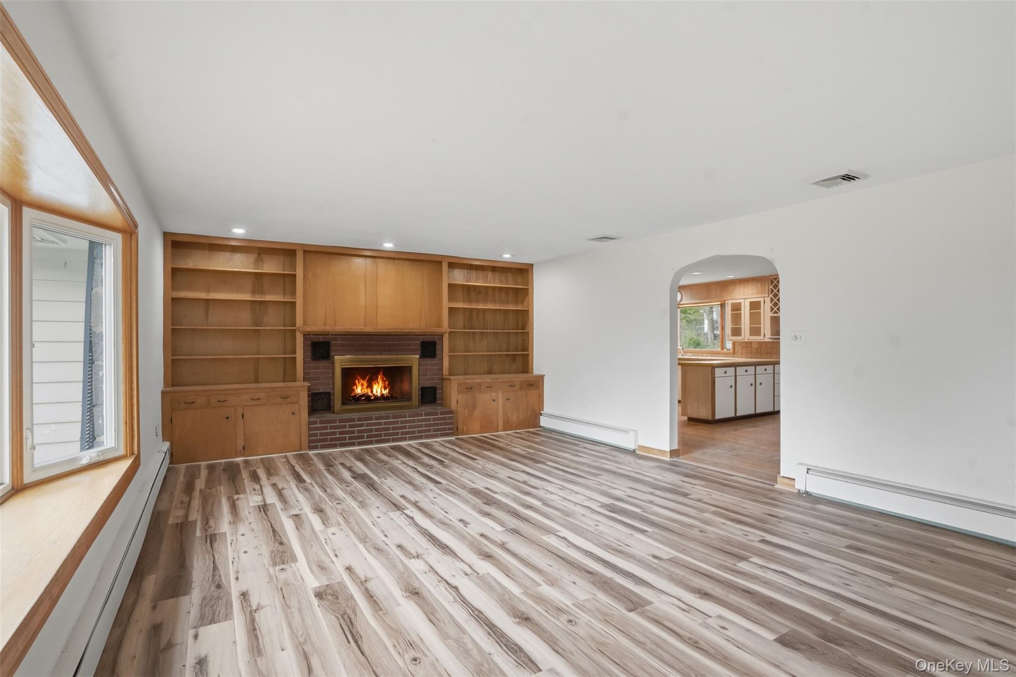 435 Samsonville Road Kerhonkson, NY 12446 - Photo 9 of 37 wooden floor fireplace and natural light in room