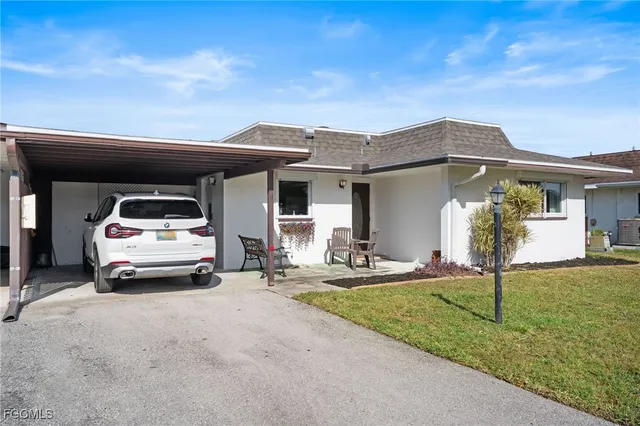 a car parked in front of a house