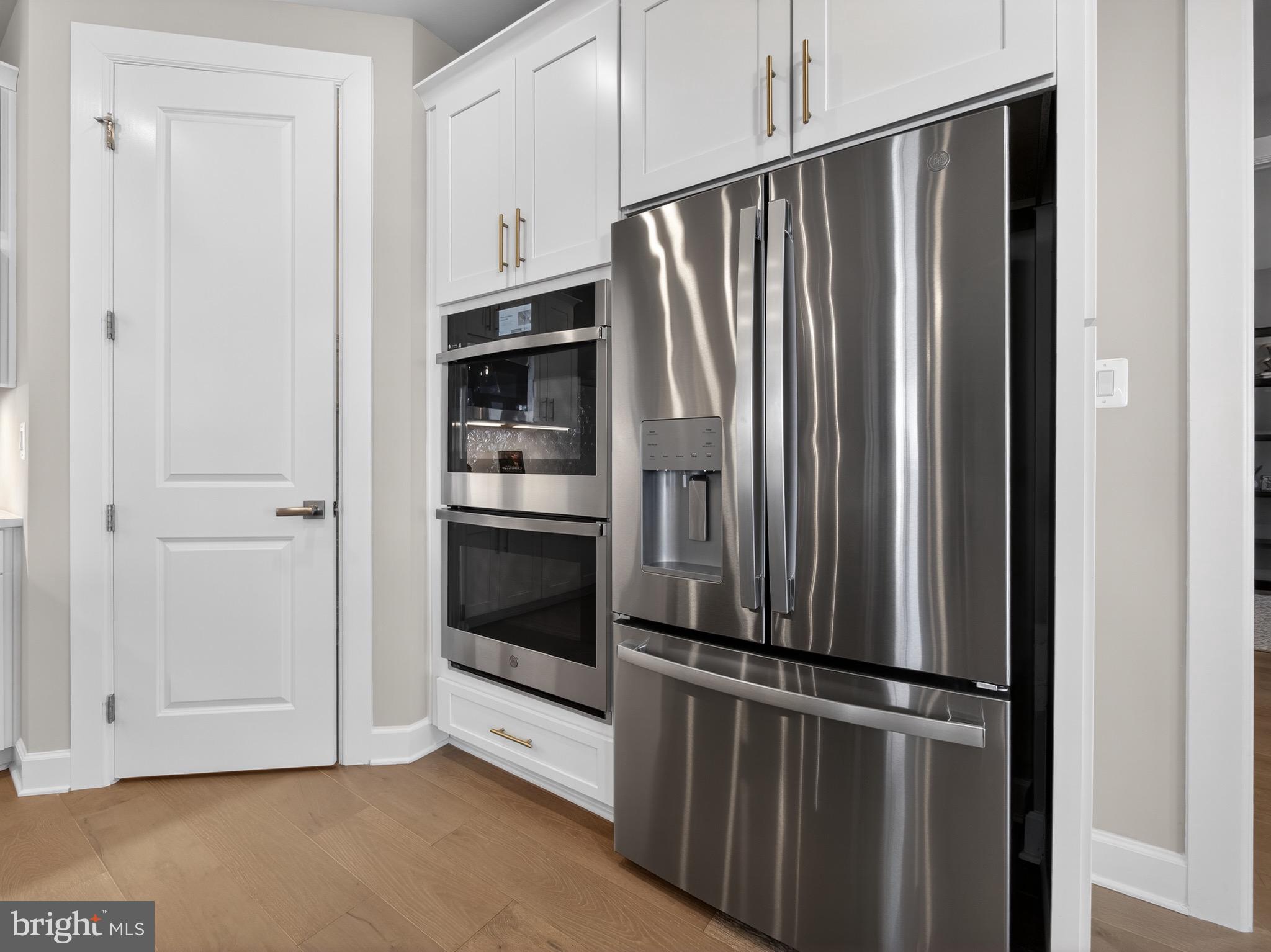 167 Brazier Lane Exton, PA 19341 - Photo 11 of 48 a view of kitchen with stainless steel appliances wooden floor and window