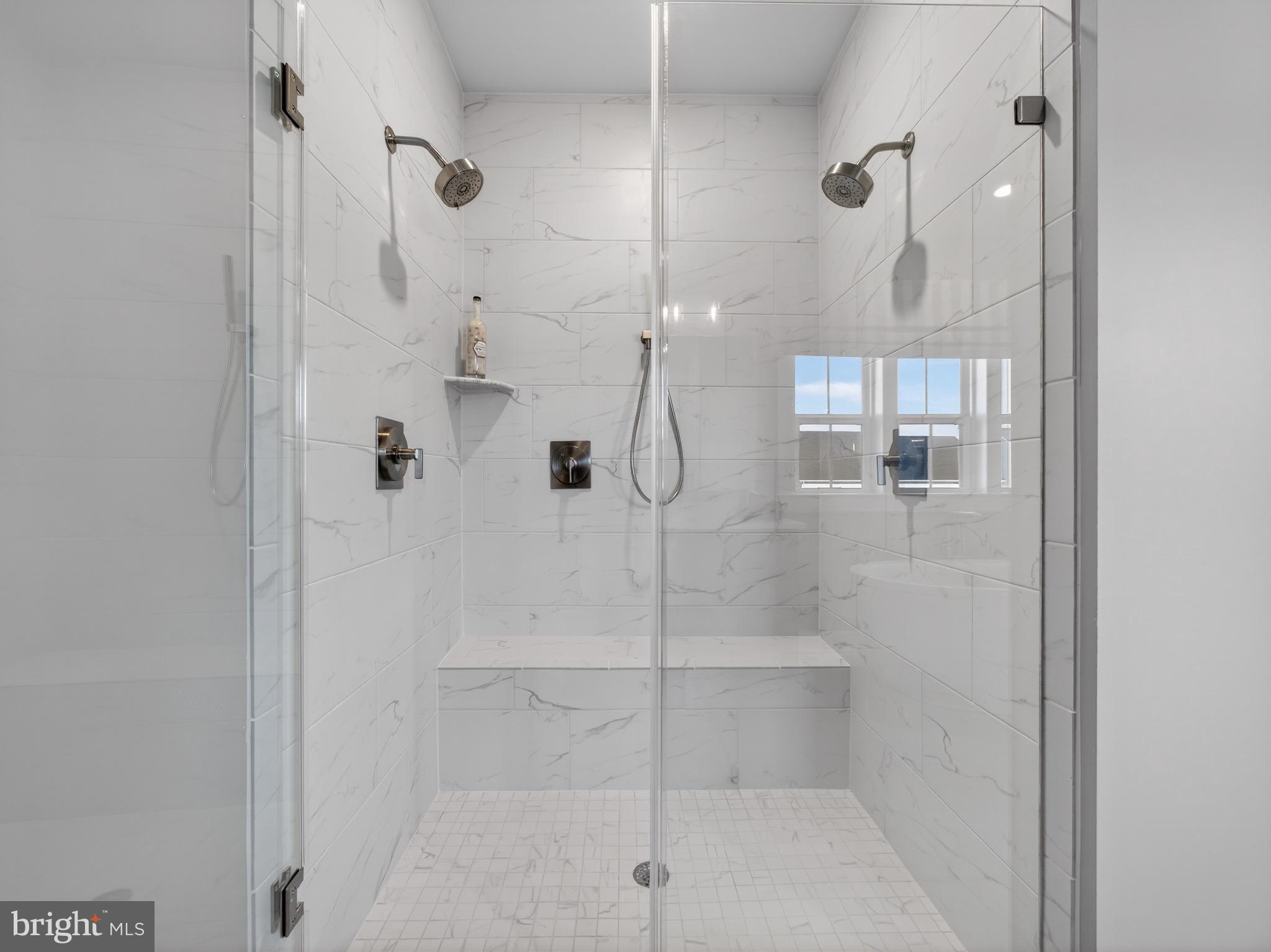 167 Brazier Lane Exton, PA 19341 - Photo 28 of 46 Sleek ceramic tile shower with modern fixtures.