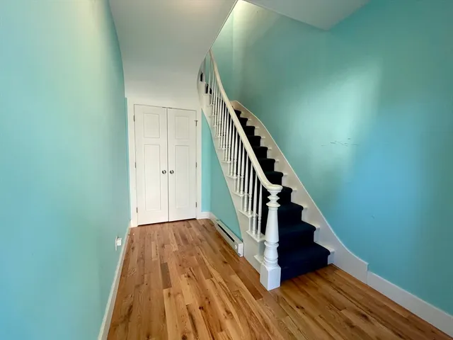 a view of entryway with wooden floor