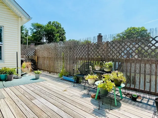 a view of a house with a yard and a garden