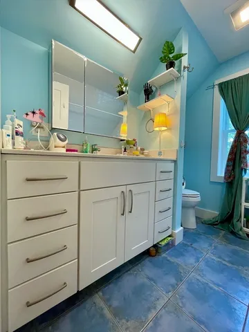 a bathroom with a tub and a shower
