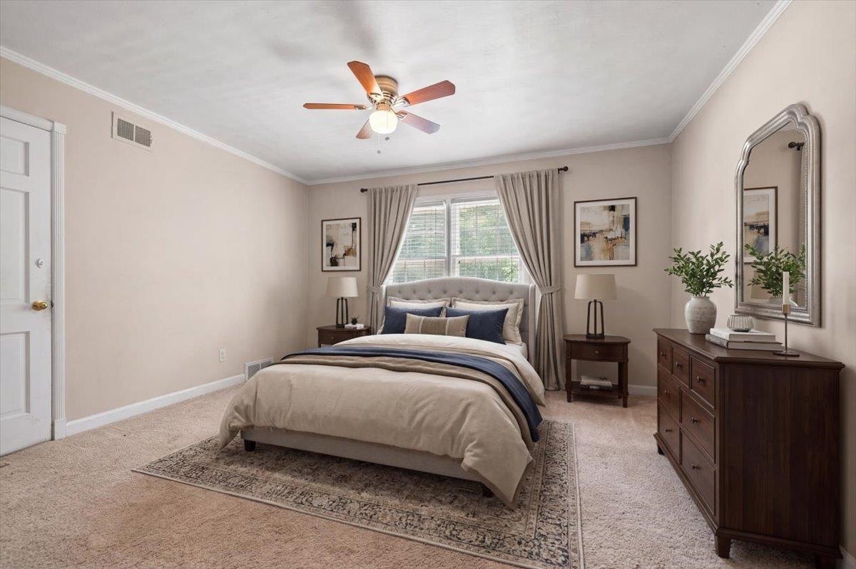 1273 Brookfield Road Memphis, TN 38119 - Photo 28 of 40 Virtually staged upstairs bedroom; Carpeted room featuring a ceiling fan with integrated lighting, a window with blinds, and white trim molding; currently being used as exercise room.