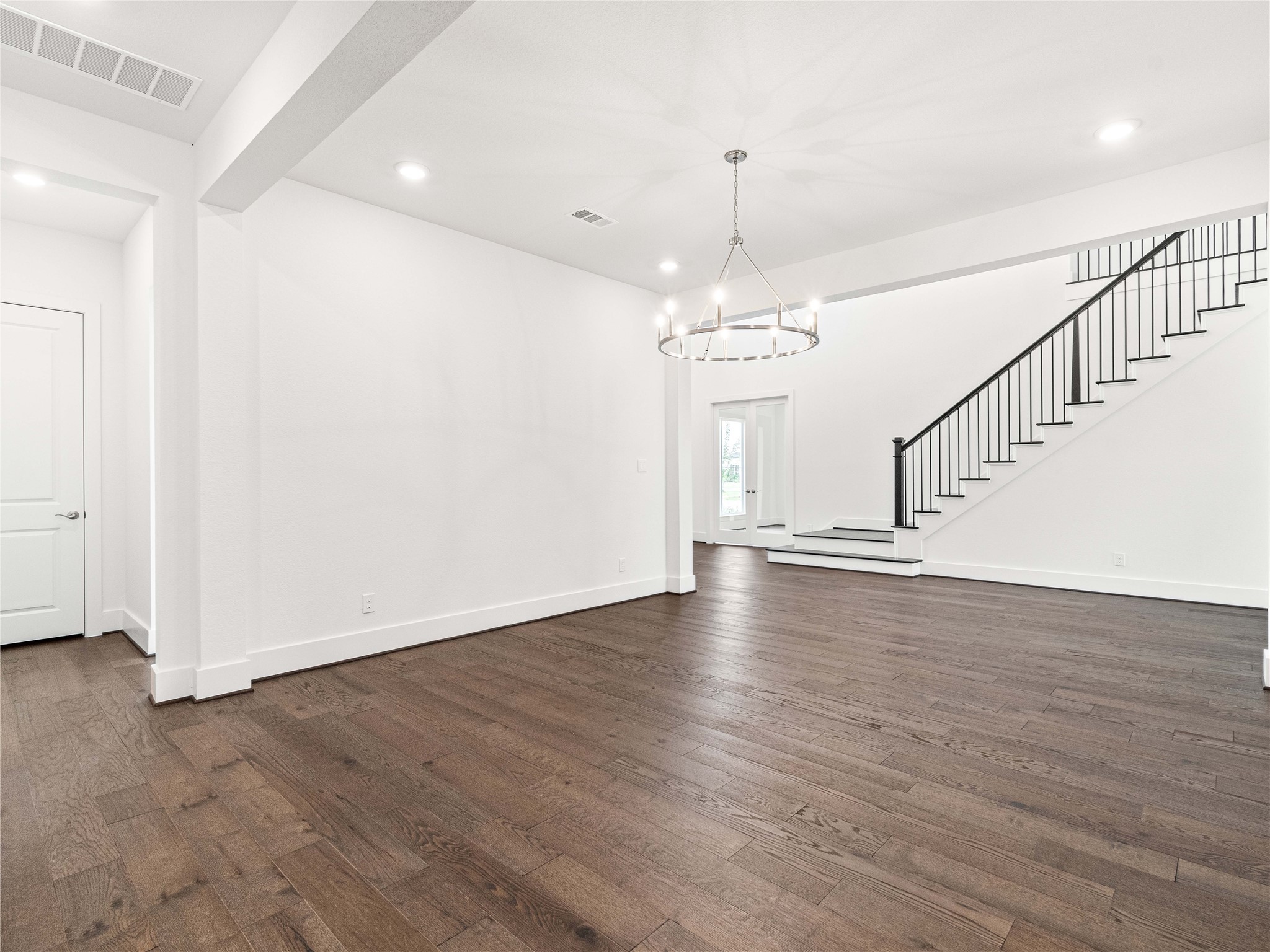 4926 Grapevine Lane Manvel, TX 77578 - Photo 12 of 41 a view of a room with wooden floor and staircase