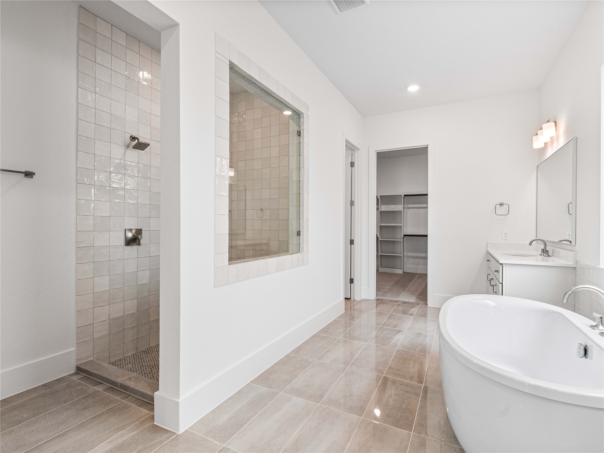 4926 Grapevine Lane Manvel, TX 77578 - Photo 14 of 41 a bathroom with a bathtub and a shower