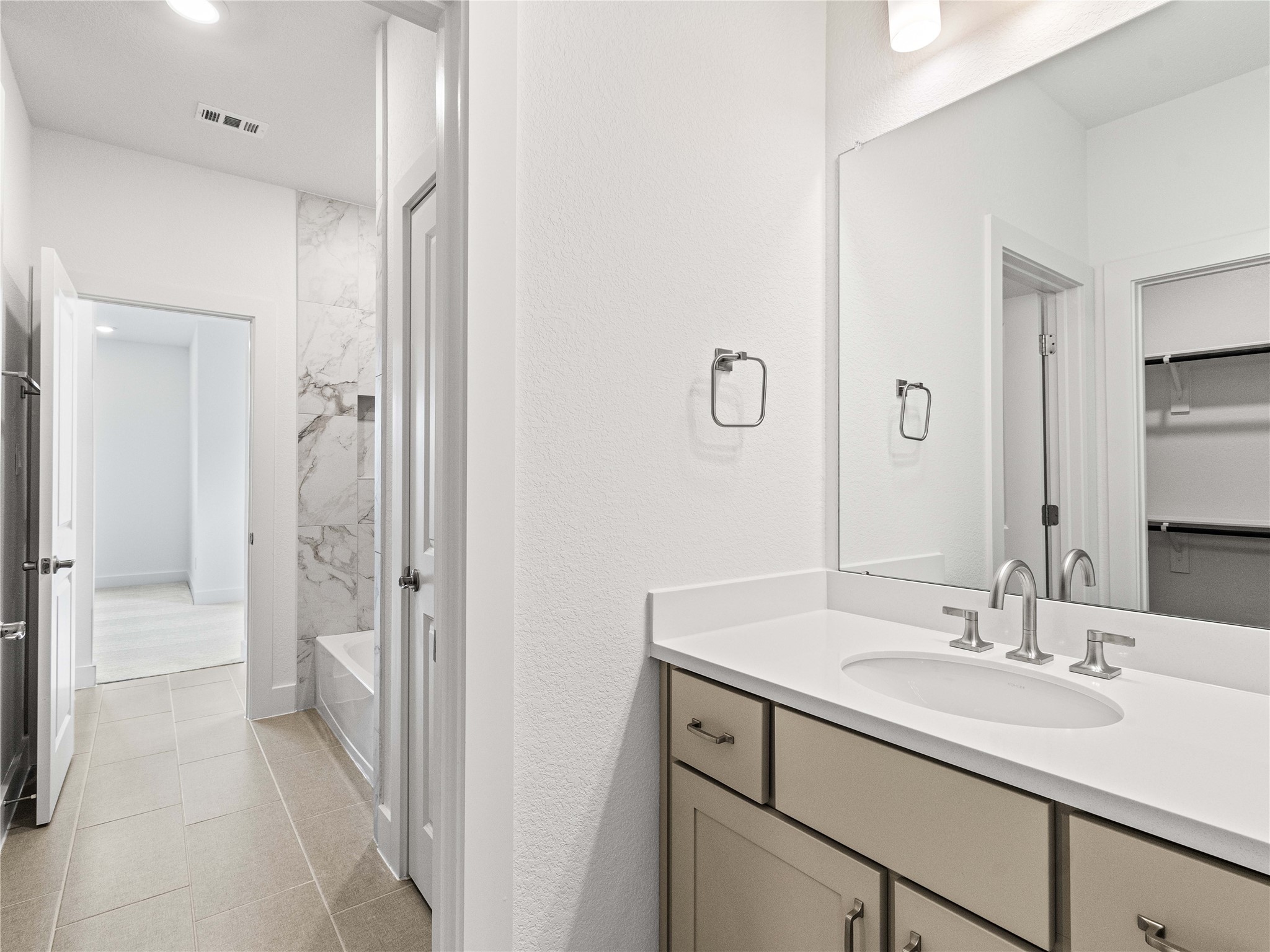 4926 Grapevine Lane Manvel, TX 77578 - Photo 18 of 41 a bathroom with a sink and a mirror