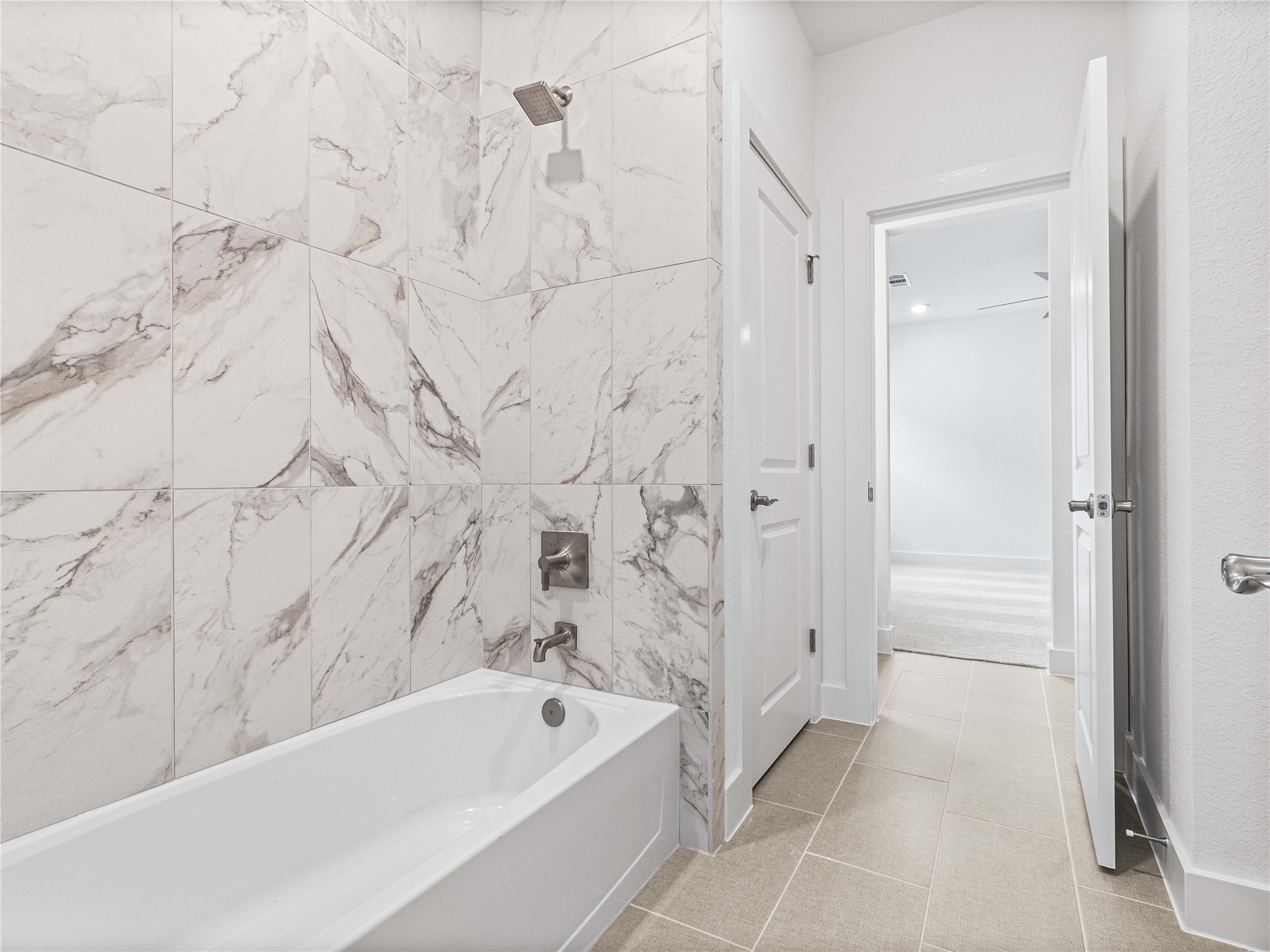 4926 Grapevine Lane Manvel, TX 77578 - Photo 19 of 41 a bathroom with a bathtub and shower