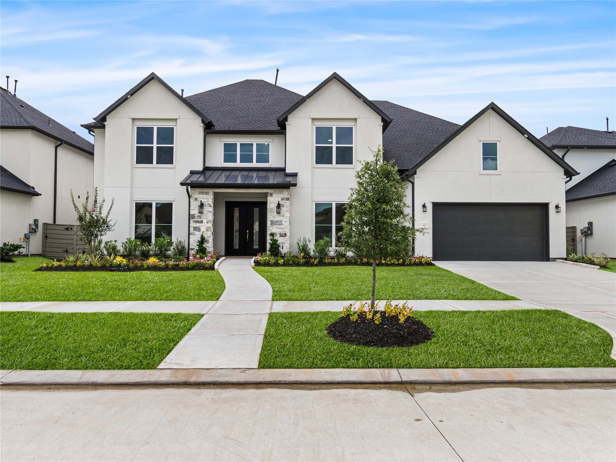 4926 Grapevine Lane Manvel, TX 77578 - Photo 2 of 41 a front view of a house with a yard and garage