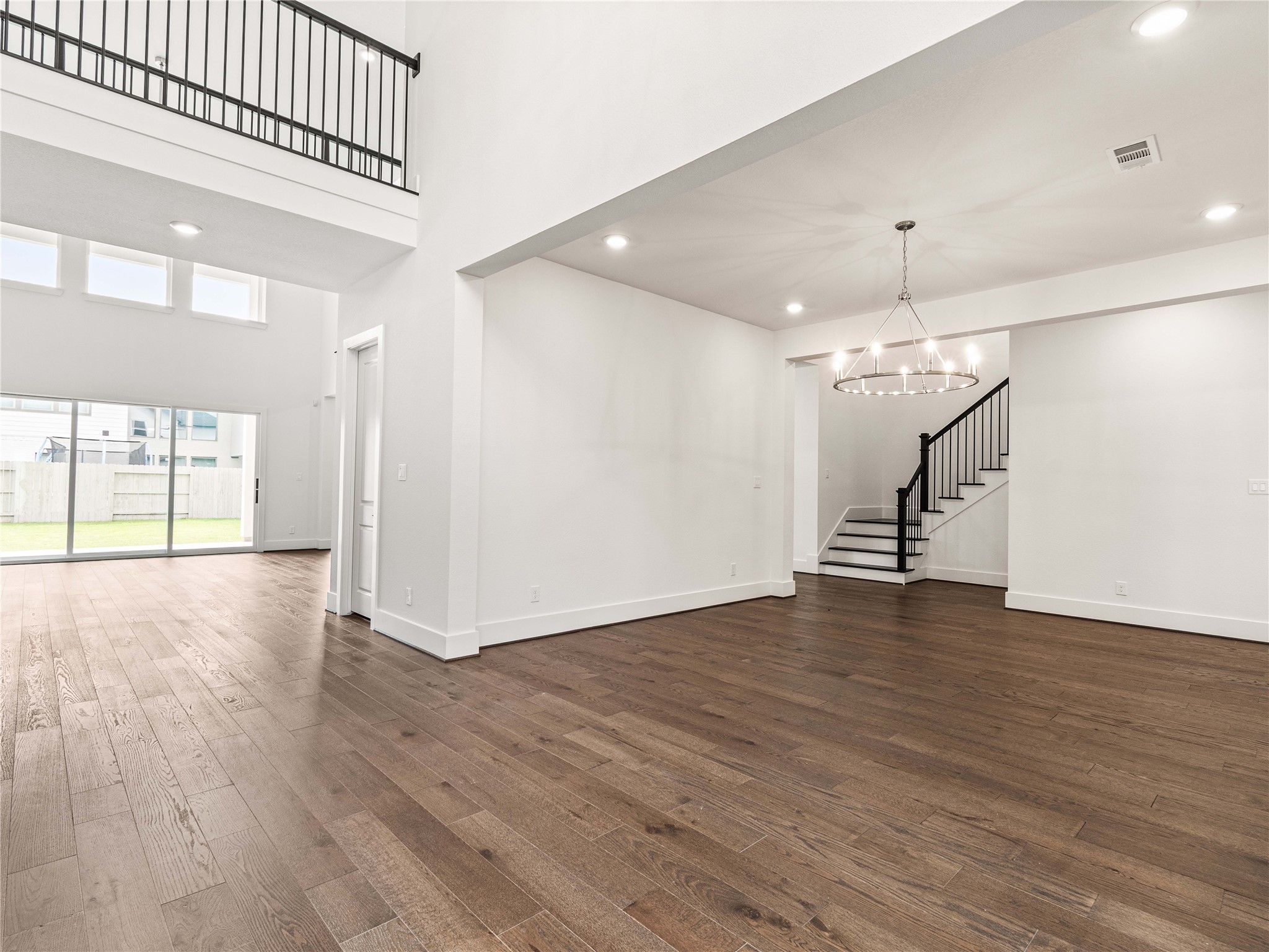 4926 Grapevine Lane Manvel, TX 77578 - Photo 24 of 41 a view of an empty room with wooden floor and a window