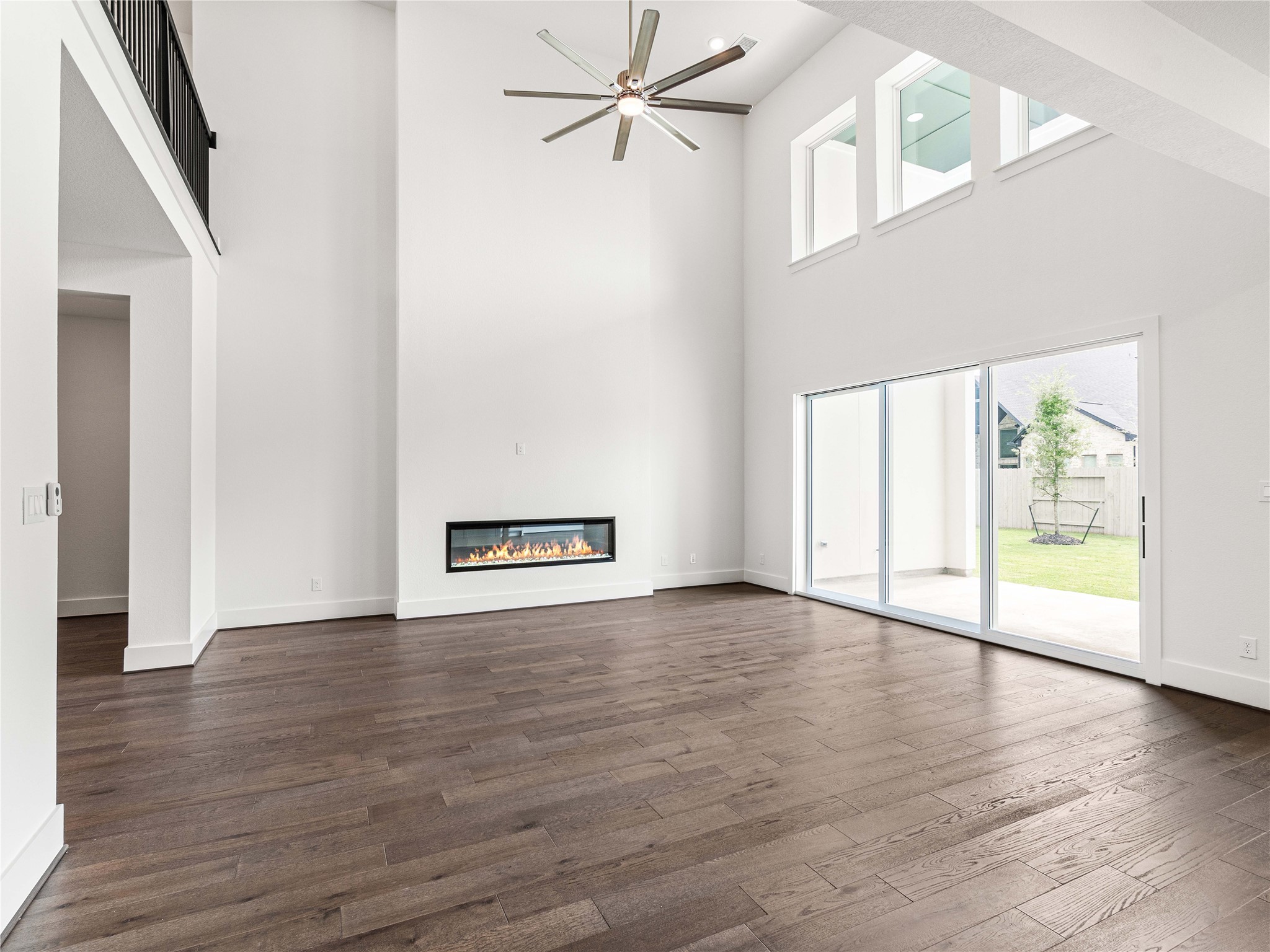 4926 Grapevine Lane Manvel, TX 77578 - Photo 3 of 41 an empty room with wooden floor and windows